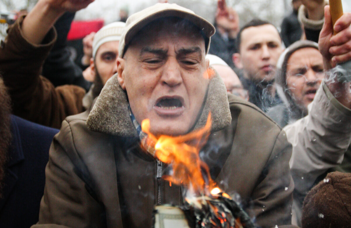Libyan burning Libyan passport during anti-Gaddafi protests in London