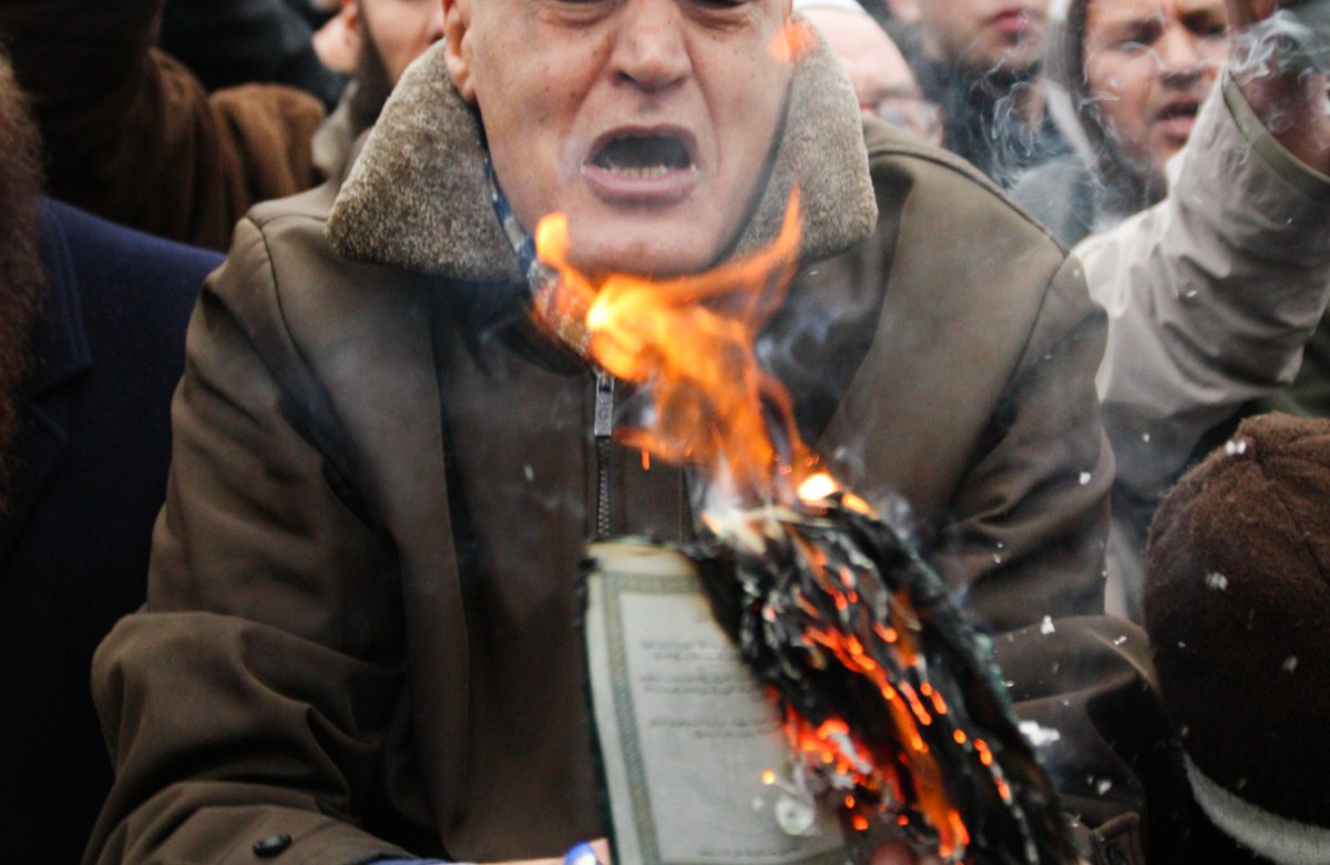 Libyan burning Libyan passport during anti-Gaddafi protests in London