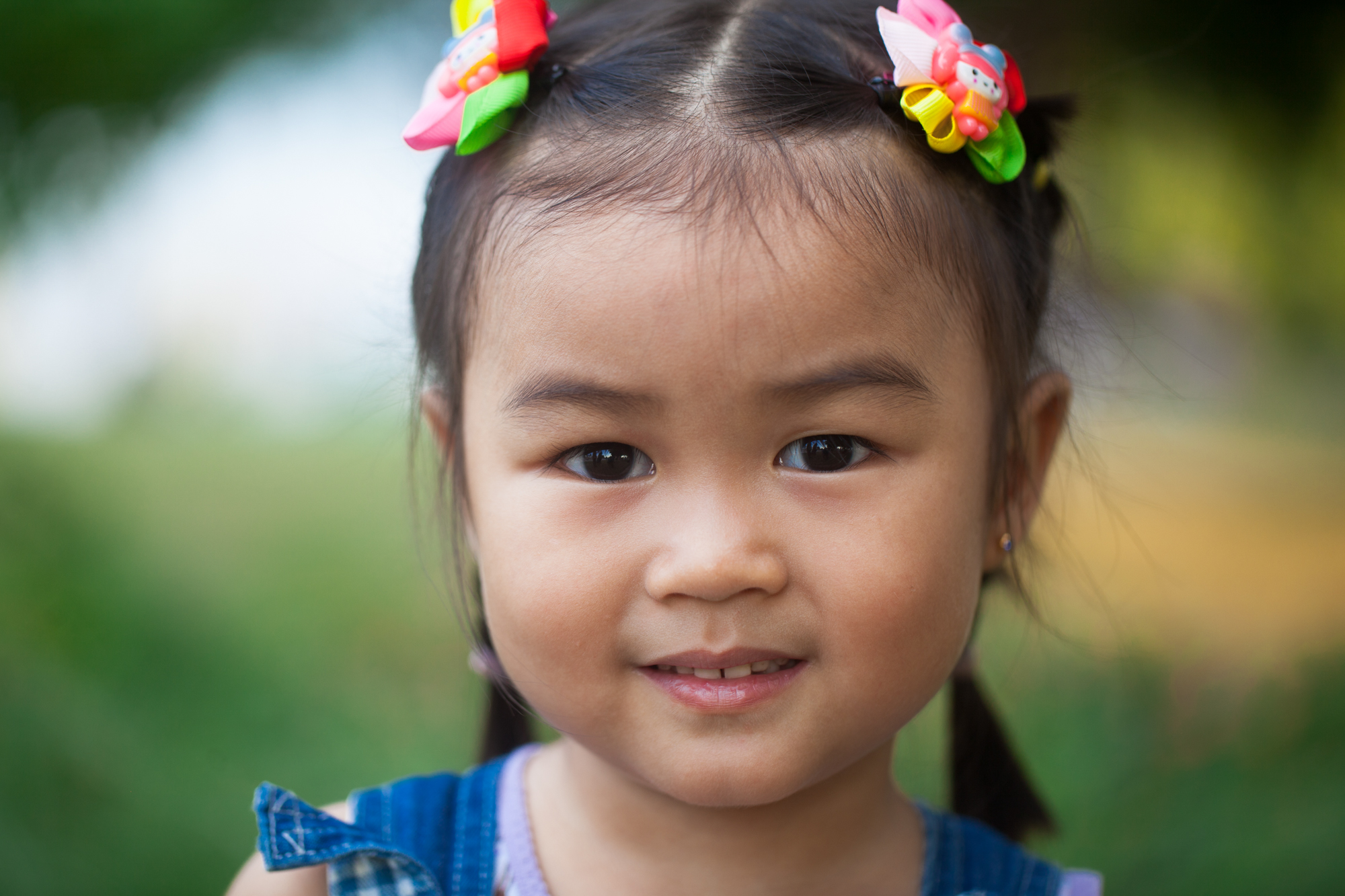 Face of Qatar portrait, green park, kid from Malaysia