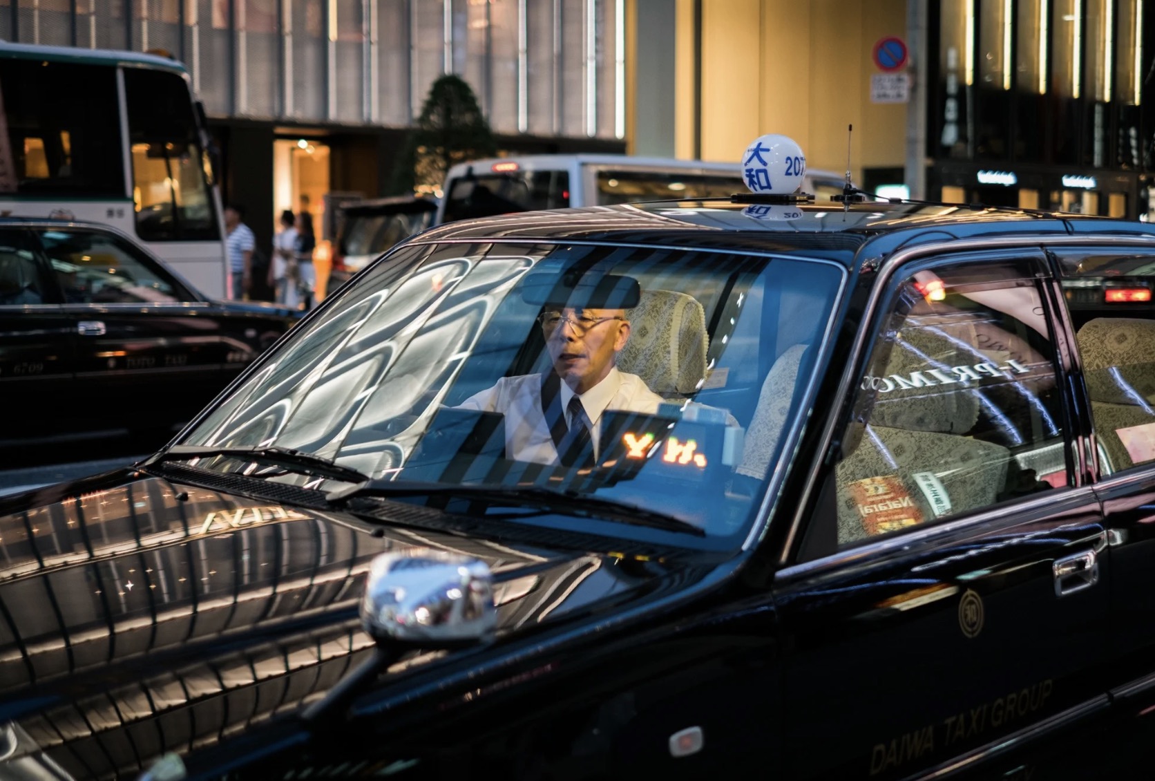 Japanese taaxi driver, Tokyo, Japan, night shot.