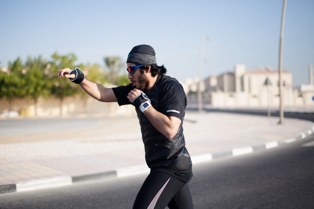 Fahad Khalid Al-Thani throwing a punch during a lifestyle brand photoshoot.
