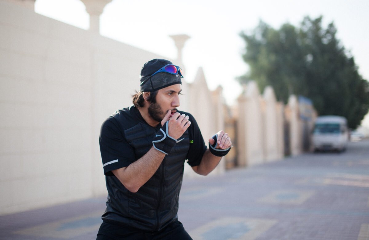 Fahad Khalid Al-Thani throwing a punch during a lifestyle brand photoshoot.