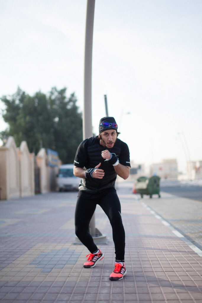Fahad Khalid Al-Thani holding a defensive boxing stance during a portrait session.