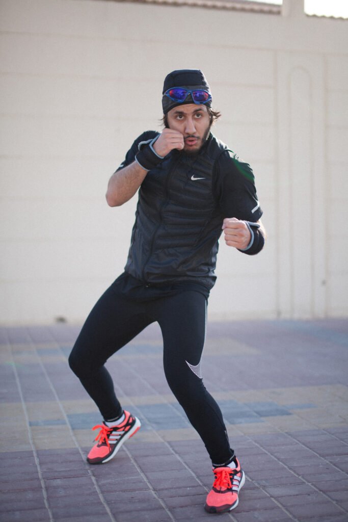 Fahad Khalid Al-Thani throwing a punch during a lifestyle brand photoshoot.