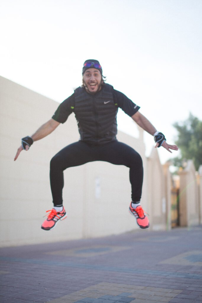 Fahad Khalid Al-Thani jumping athletically in the air during a lifestyle brand photoshoot.