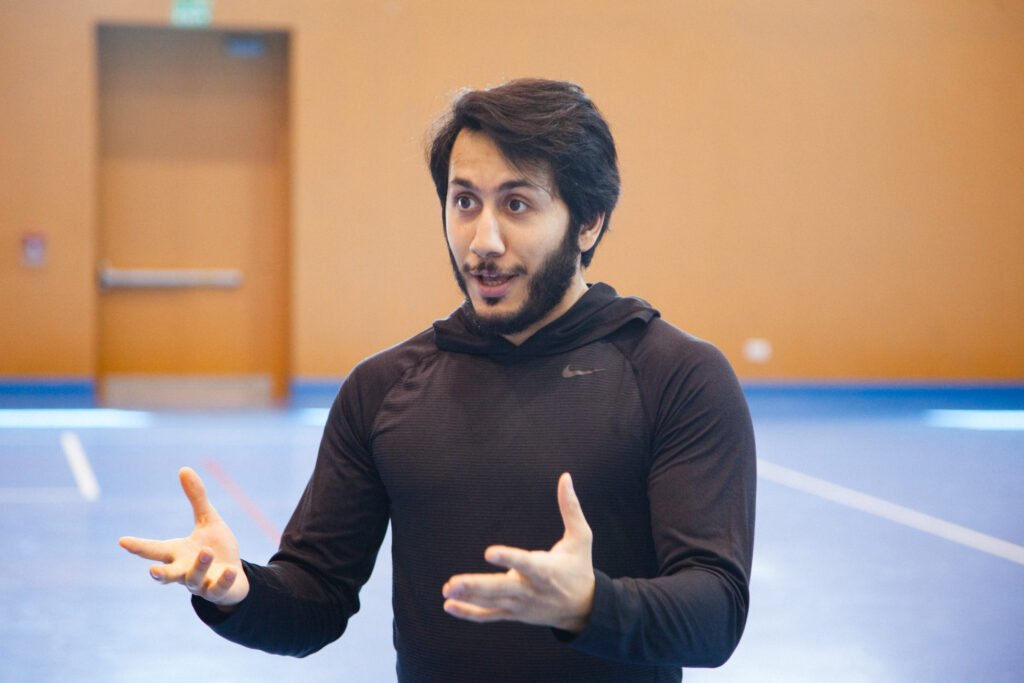 Fahad Khalid Al-Thani speaking to students during a lifestyle brand photoshoot.